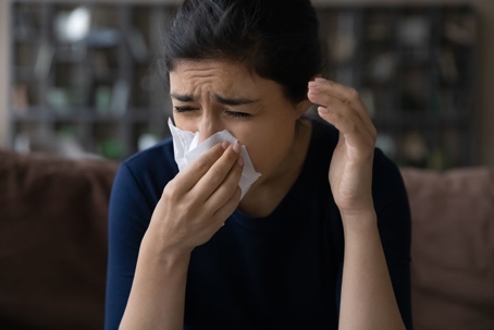 person with kleenex