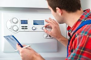 HVAC contractors doing a heating repair on a homeowner's heating system