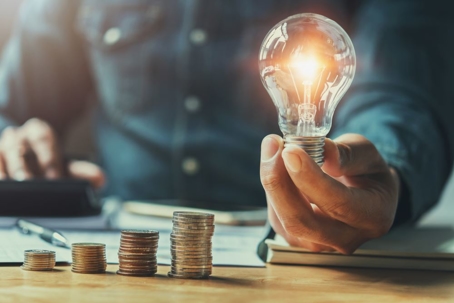 A man holding a bulb