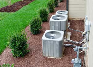 Several gray air conditioning units