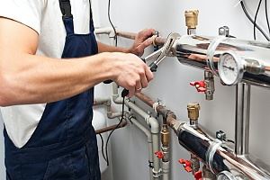 A guy working with the HVAC system