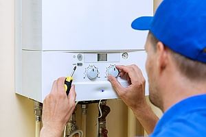 A man  is adjusting controls