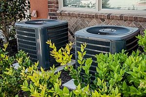 two adjacent air conditioning units from a central air system