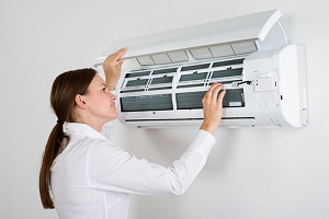 a woman confused about how to check the freon in her home air conditioner