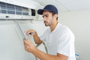 new hvac contractor doing his first air conditioning maintenance work