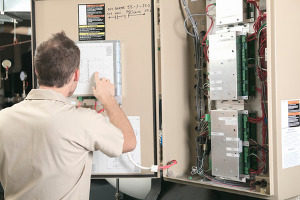 hvac contractor working with a furnace