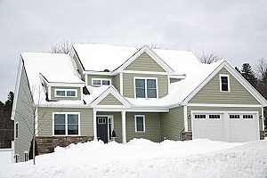 a home in Maryland that is covered in snow during the winter and thankfully the homeowners received a new heating system from Maryland HVAC contractors before the snow storm