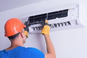 Gaithersburg, MD HVAC contractor installing the indoor unit of a brand new ductless mini-split air conditioner