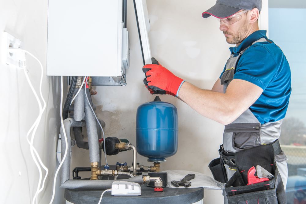 A technician fixing the furnace