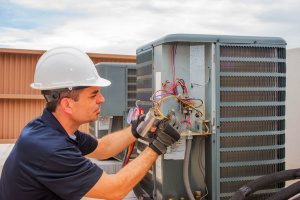 HVAC contractor in Gaithersburg, MD performing routine HVAC maintenance