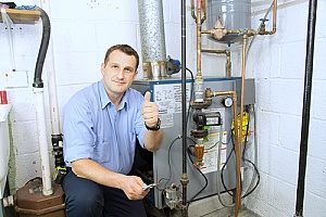 a Gaithersburg, MD HVAC contractor giving a thumbs up to a homeowner after he just performed a complete furnace installation so the home can be kept warm during the winter