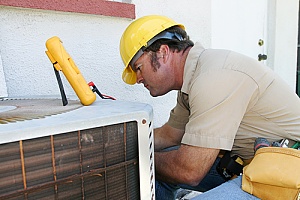 Contractor working to replace an ac unit