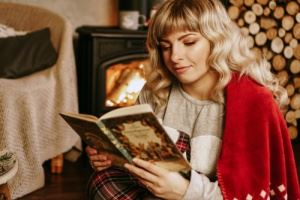 woman dressing warm to save energy during the winter months