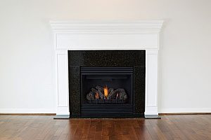a natural gas fireplace in a Maryland home that does not need another heating system since the fireplace puts out enough warmth into the air