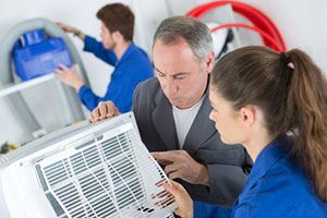 technicians checking the AC
