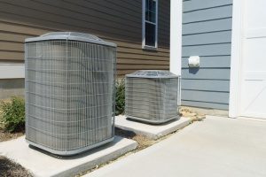 two outdoor HVAC units experiencing one of the most common HVAC problems faced daily by homeowners